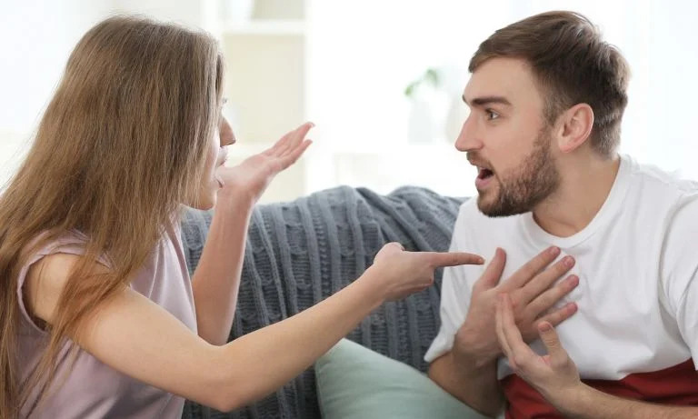 Couples conflict A woman pointing out his boyfriend that he is guilty in their relationship